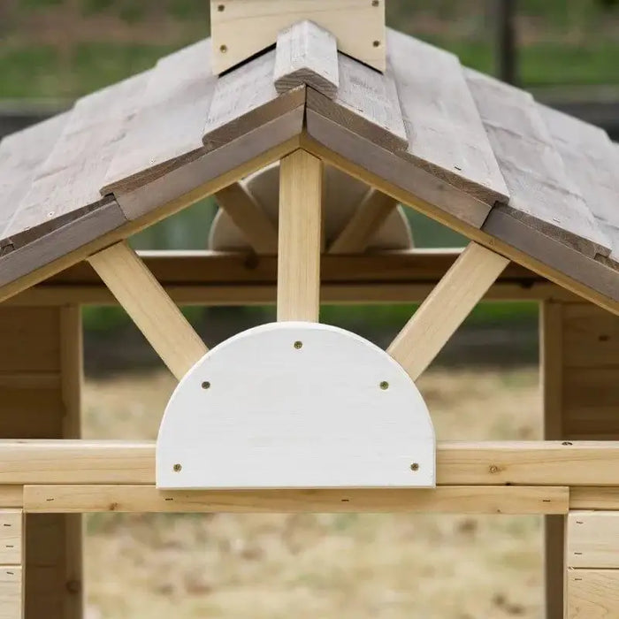 Wooden outdoor playhouse roof with natural fir wood and decorative trim detail