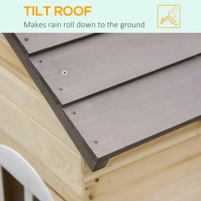 Close-up of a wooden outdoor playhouse with a tilt roof for rain runoff
