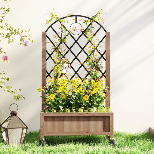Wooden planter box on wheels with black diamond trellis, yellow flowers, green climbing plants, and outdoor lantern on grass