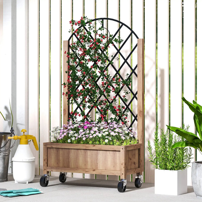 Wooden planter with diamond trellis on wheels holding climbing red-flowered vine and purple-white flowers