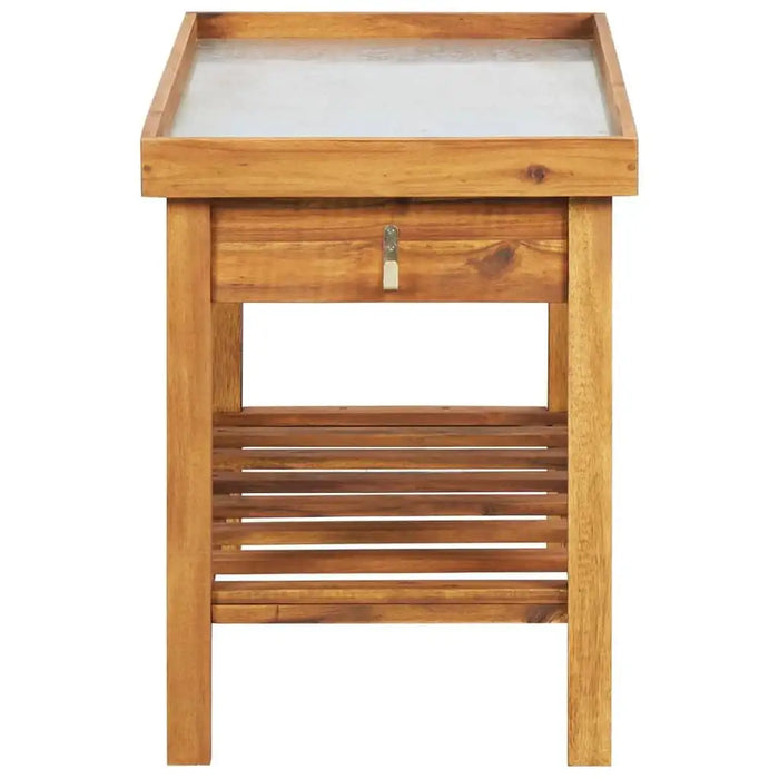 Wooden potting bench with zinc worktop, drawer, and slatted shelf for garden