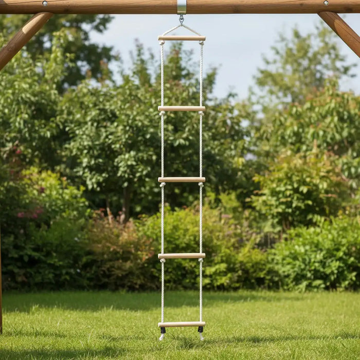 Wooden rope ladder with five rungs hanging outdoors on playground frame, green grass below