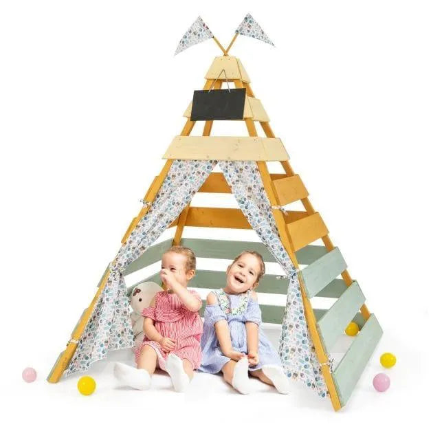 Two children playing inside a wooden Montessori-inspired teepee tent with floral curtains.