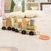 Wooden train set educational pull-along toy for toddlers on soft carpeted playroom floor