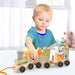 Toddler playing with wooden train set educational pull-along toy on white table