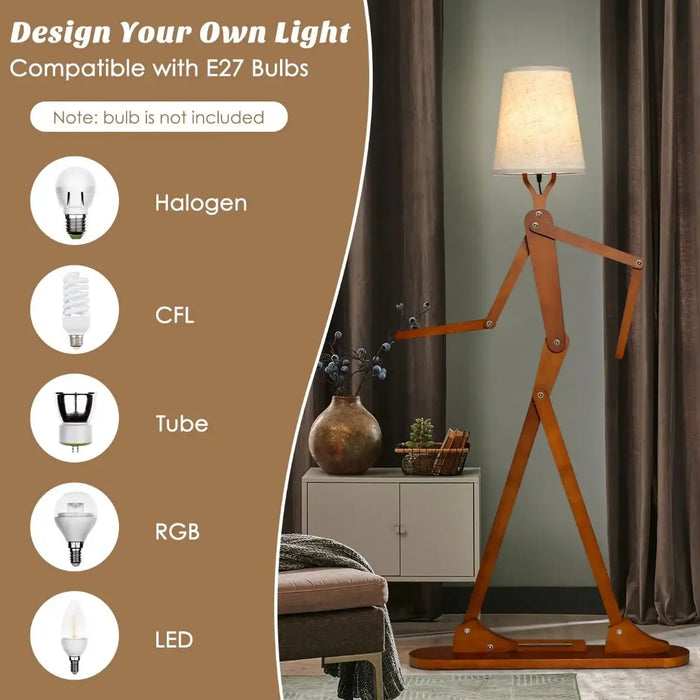 wooden tall floor lamp shaped like a walking figure with adjustable arms and beige lampshade in modern living room