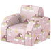 Pink children's armchair with unicorn, rainbow, moon, and star pattern