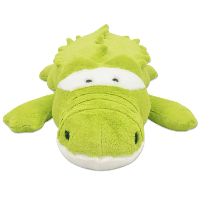 Green plush toy alligator on a white background