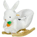 Plush rabbit-shaped rocking chair with carrot toy on a white background