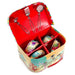 Children's dinosaur tin kitchenware set in colorful carrying case with utensils and bowls
