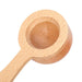 Close-up of a handcrafted wooden cooking spoon on a white background