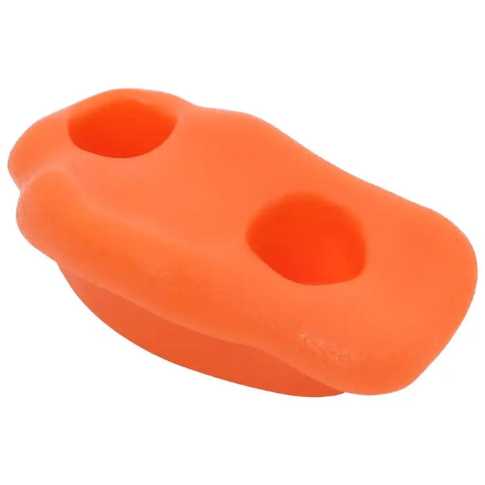 Bright orange kids climbing rock hold with two grip holes on a white background