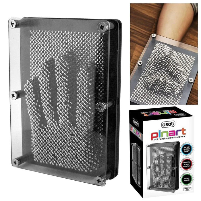 3D metal pin art frame toy creating a hand impression, shown on a desk with packaging.