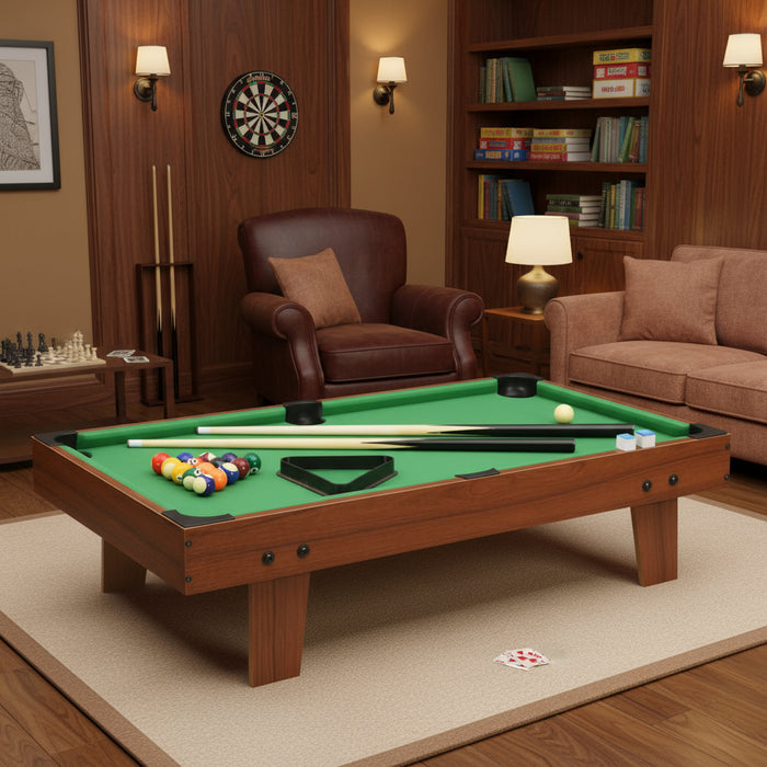 3ft tabletop pool table on carpet in a cozy game room with cues and billiard balls