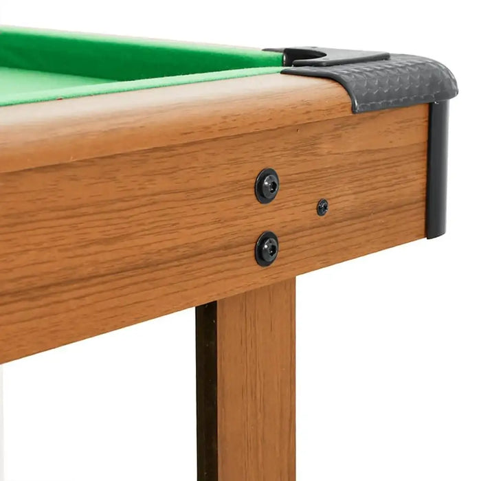 Close-up of 4ft portable billiard table with wood frame and green felt surface