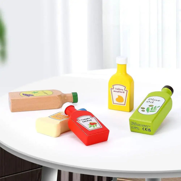 5-piece wooden kids sauces and oils bottle set on a white table, kitchen play toy