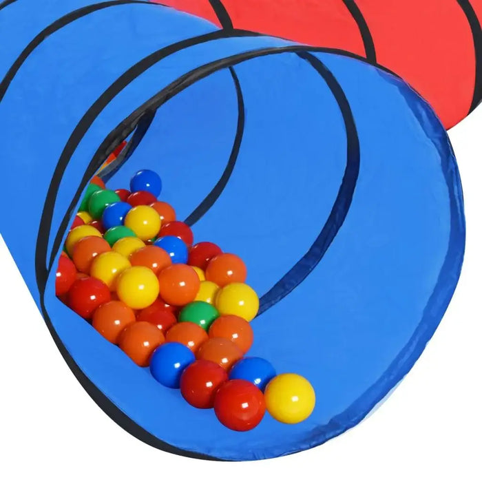 Colorful plastic play balls in blue play tunnel for kids