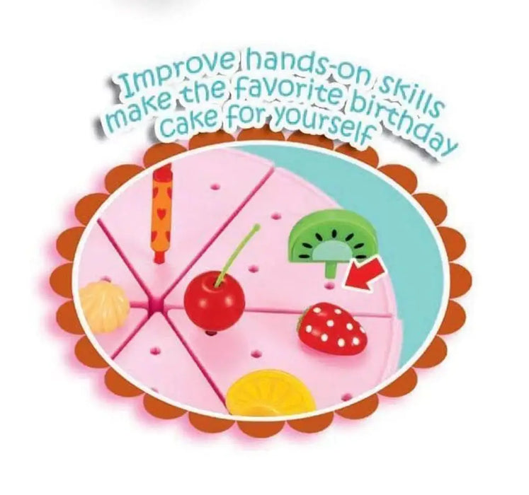 Pink wooden birthday cake playset with toy fruit toppings and candle, text above
