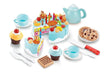 Wooden birthday cake playset with tea service, cupcakes, cookies, and accessories on white background