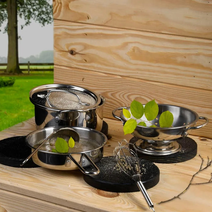 6-piece stainless steel mud kitchen playset with bowls, colander, and whisk on wooden table