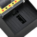 Automatic card shuffler with black base, club, heart, diamond, and spade symbols on yellow edge