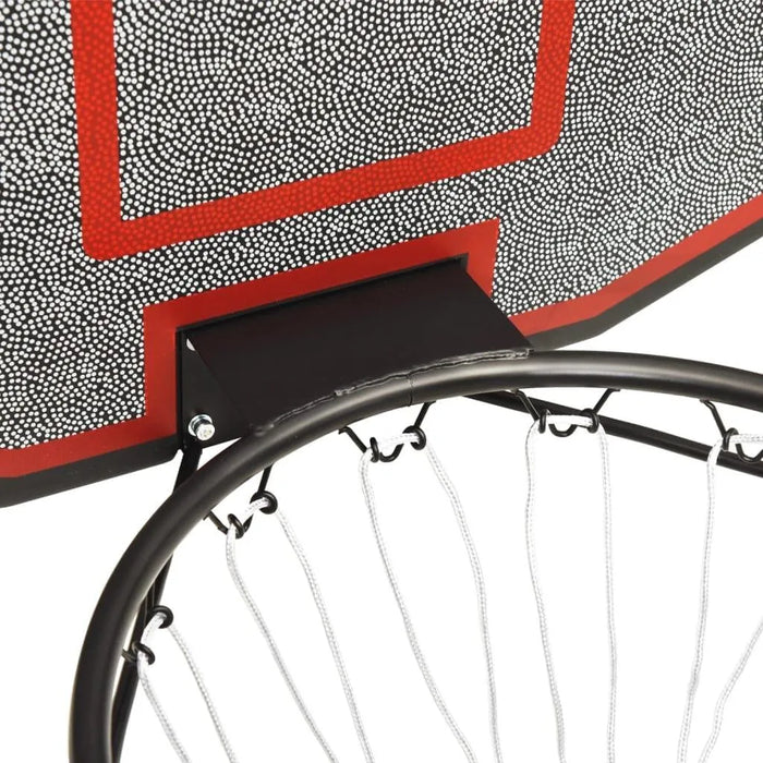 Close-up of basketball backboard set with steel rim and white net, wall-mounted design