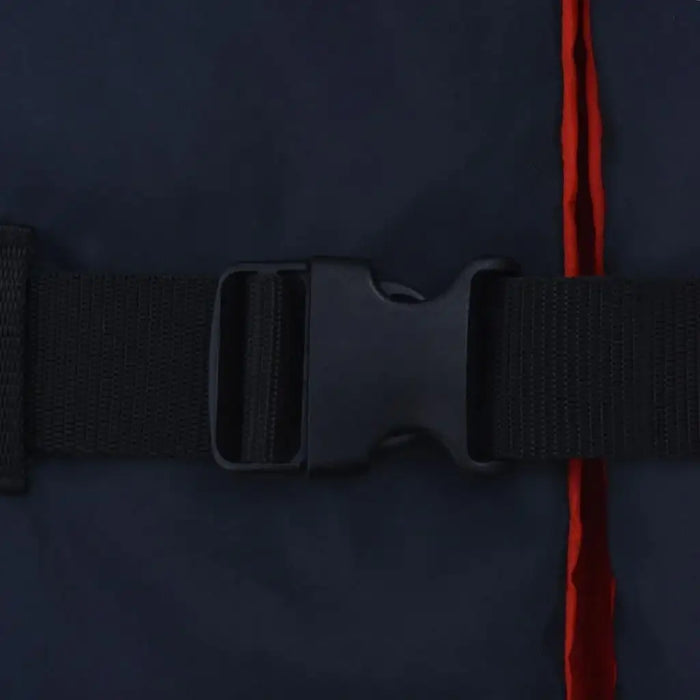 Navy blue buoyancy aid close-up with black buckle and orange trim