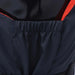 Close-up of navy blue buoyancy aid with orange trim and elastic back panel