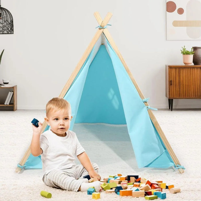 Toddler playing with blocks near a blue canvas play tent in a modern living room.