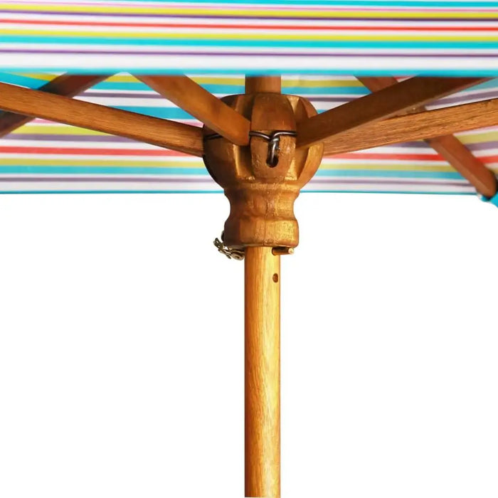Close-up of wooden parasol pole with rainbow striped canopy, outdoor picnic table accessory