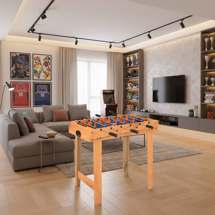 Compact professional football table in modern family games room with TV and trophies