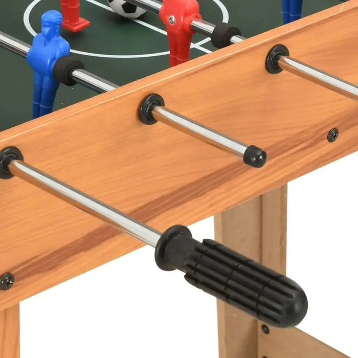 Maple wood compact foosball table with red and blue player figures and soccer handles