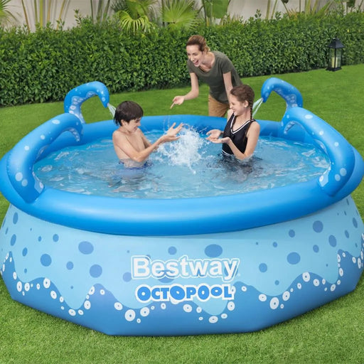 Kids playing in Bestway Octopool inflatable pool with tentacle sprayers in a backyard