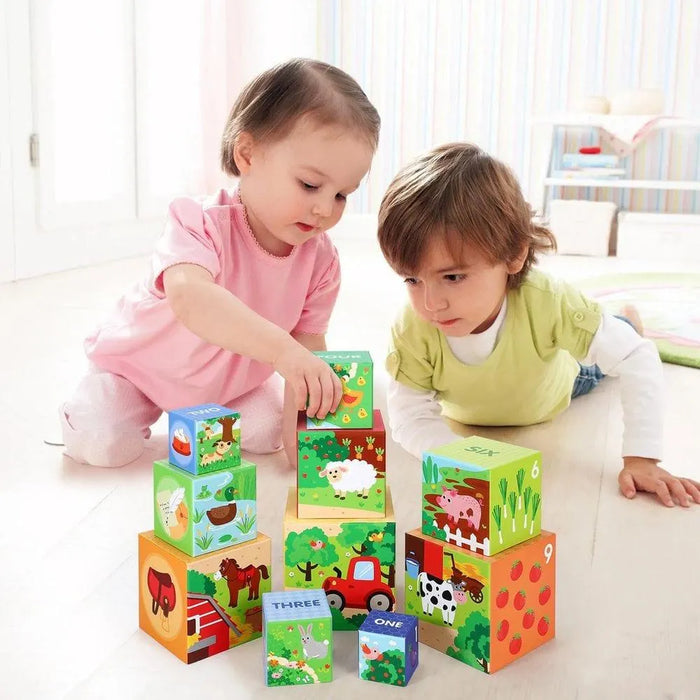 Two toddlers playing with colorful Montessori stacking cubes, educational toy set indoors