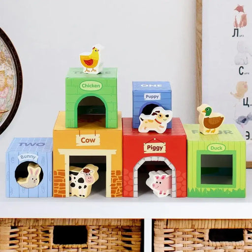 Farm animal stacking cubes toy with wooden animals and colorful boxes labeled cow, piggy, and duck