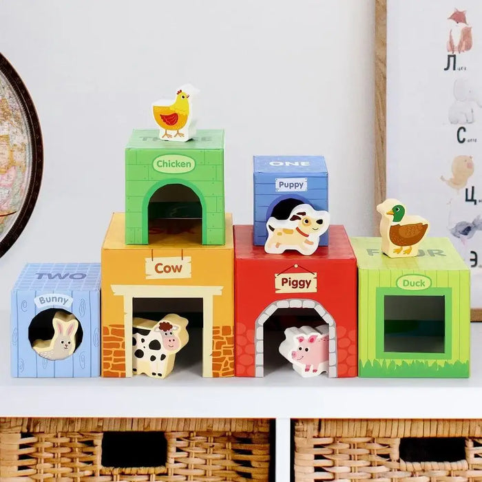 Farm animal stacking cubes toy with wooden animals and colorful boxes labeled cow, piggy, and duck