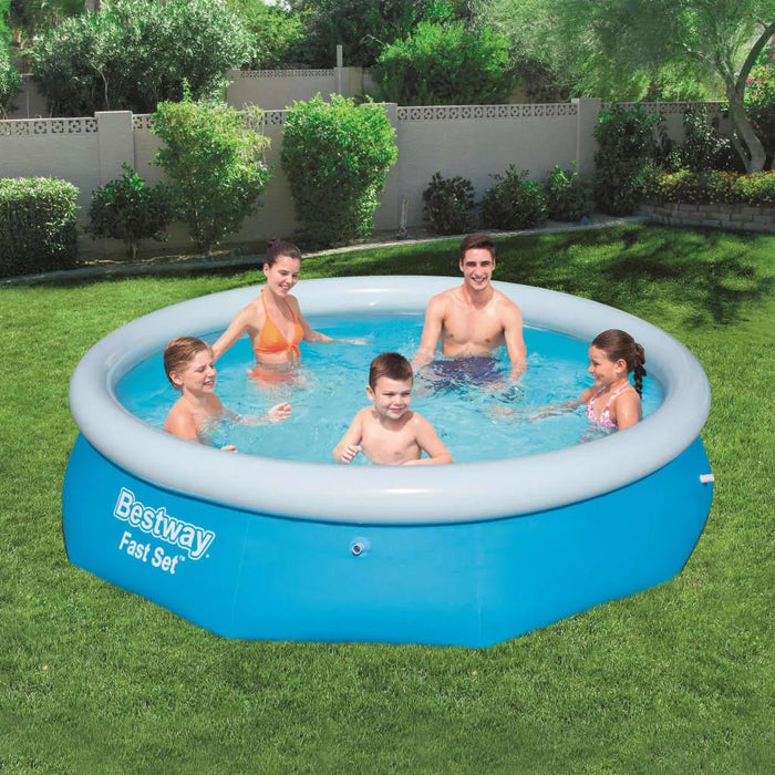 Family enjoying Bestway Fast Set inflatable pool in backyard on green grass