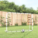 Football net rebounder with white and black steel frame in garden, soccer ball in front