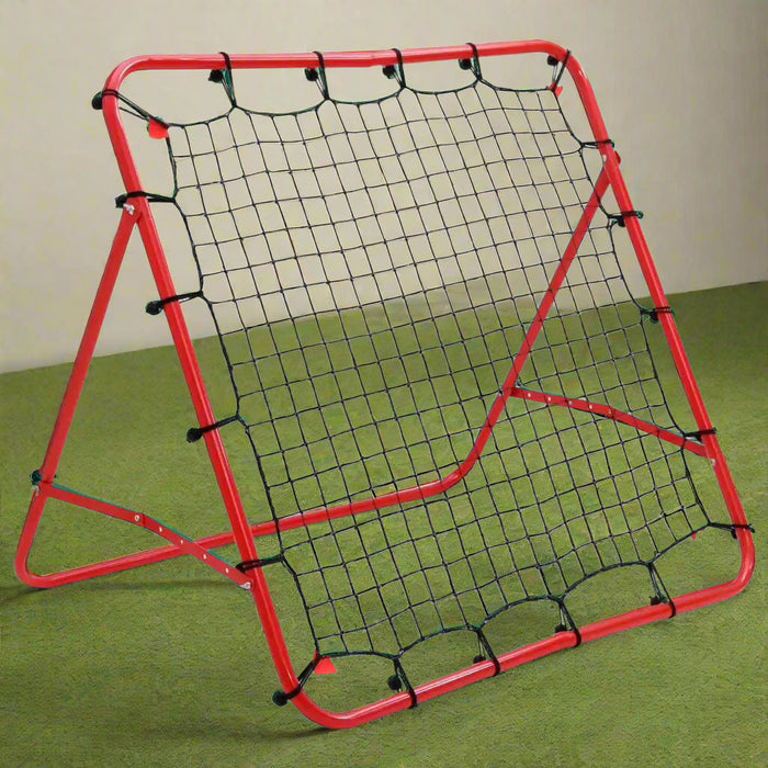 Football rebounder with red steel frame and black net on green indoor turf