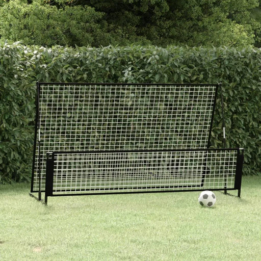 Football rebounder net with steel and fiberglass frame on grass with soccer ball