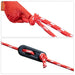 Close-up of red and white tent rope with plastic tension adjuster, outdoor camping gear