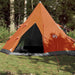 Orange and grey taffeta camping tent set up outdoors on grass in a forested area