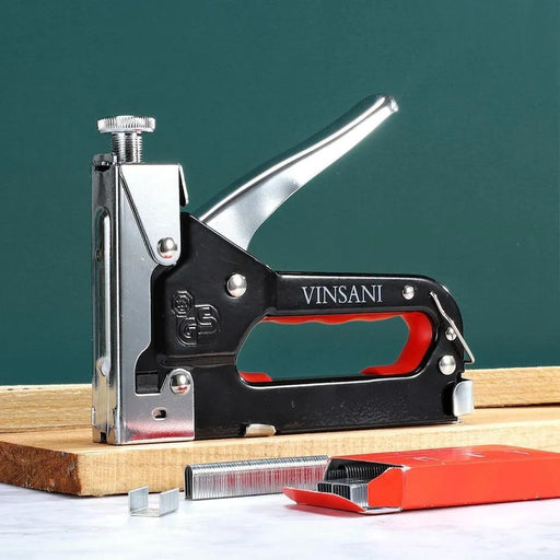 Vinsani heavy duty industrial staple gun with red handle and staples on wooden board