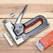 Vinsani heavy duty industrial staple gun with box of staples on wooden surface