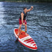 Man paddleboarding on Hydro-Force Fastblast Tech inflatable SUP in blue water