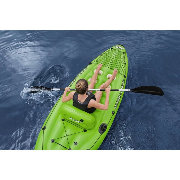 Woman paddling green Hydro-Force inflatable kayak on open water