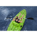 Woman paddling green Hydro-Force inflatable kayak on open water