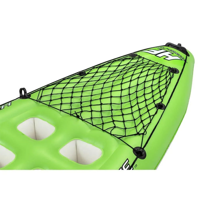 Green inflatable kayak with black bungee cargo net on the deck, close-up view