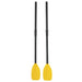 Pair of black plastic oars with yellow blades for inflatable boat on white background