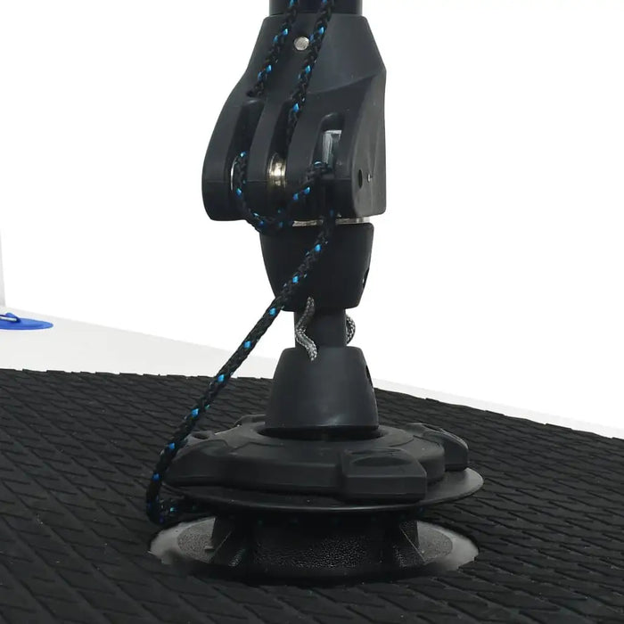Close-up of SUP board mast base with rope and textured black deck